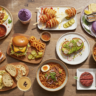 Mouthwatering U.S. Food Trends displayed on a large wooden table, featuring birria tacos, Korean corn dogs, smashburgers, ube desserts, Nashville hot chicken, fancy toast, birria ramen, tinned fish boards, espresso martinis, butter boards, and plant-based meats.